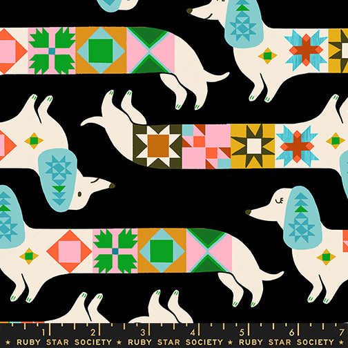 Quilty Dog in Soft Black quilting cotton by Ruby Star Society — a very good dog who has clearly been helping with the quilting on Ruby Star's signature soft black — pattern repeat