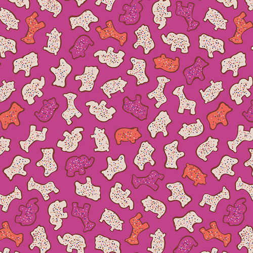 Cinnamon Toast Circus Animals quilting cotton – frosted animal cookies on a bright magenta ground – by Dana Willard for Art Gallery Fabrics