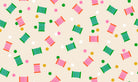 Spools in Shell quilting cotton by Ruby Star Society — spools of thread tossed across the cloth in a rainbow of colours on a soft blush pink