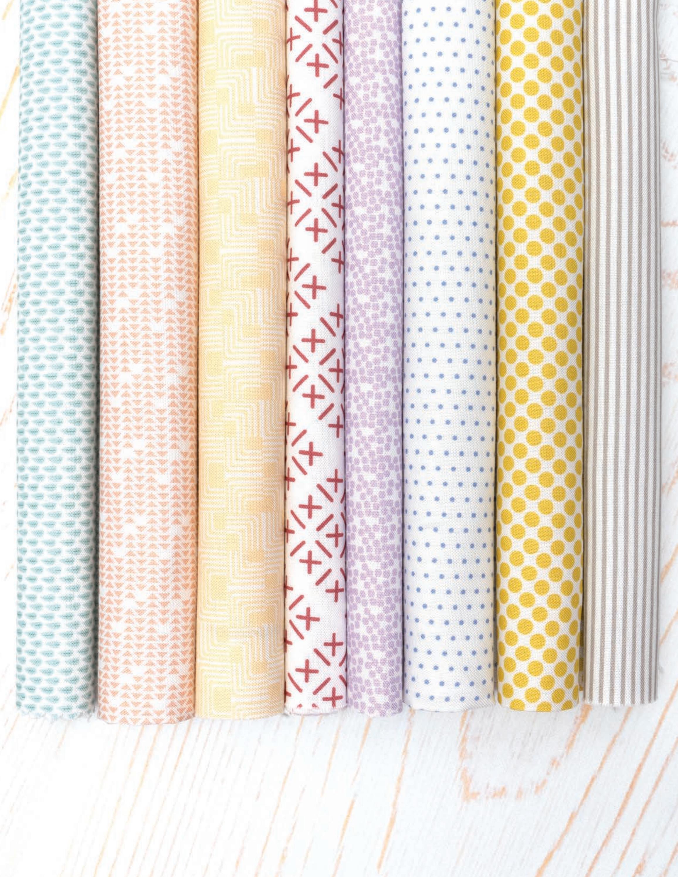 Gathered Bonbons half metre bundle by Jen Kingwell for Moda – the eight background fabrics shown from a second angle, in stone, citrine, lavender, lilac, blush, butterscotch, apricot and sage
